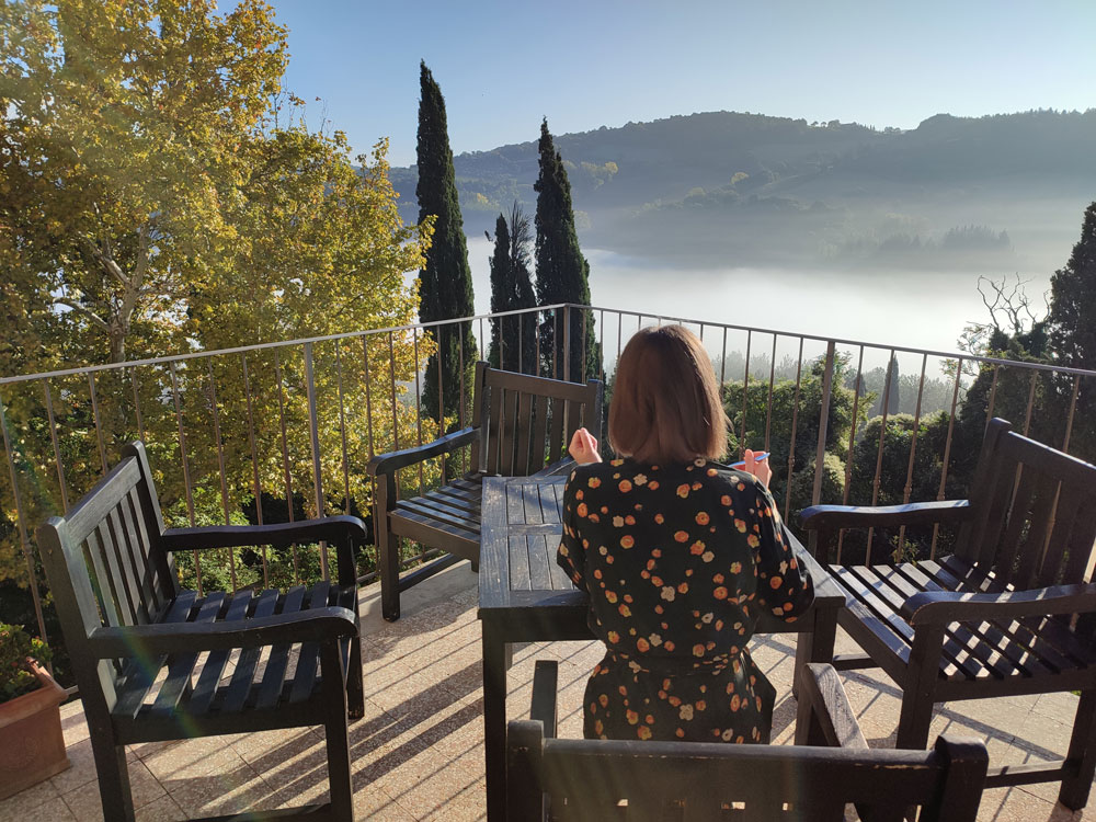 A Haven For Stories - Writers Retreat. The view from the balcony as a woman writes.